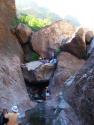 Wading through pool - to get to cave - to scale to top of rock!