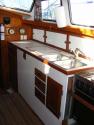 View of galley from companionway; lots of drawers & behind counter storage; large windows for awesome view!