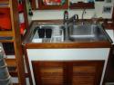Large stainless double sinks (transmission can be easily accessed below)