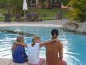 Carolyne, Chandler and Emilie hanging out at the pool