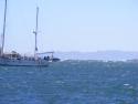 Third Day anchored in front of jetty