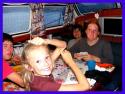 Tim, Carolyne, Sam and Isabelle eating pizza and playing games